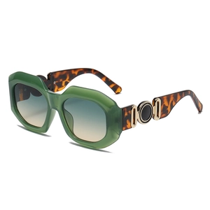 Vintage oversized green sunglasses with gradient lenses and tortoise shell patterned temples