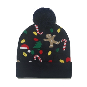 Detail of navy knit Christmas hat featuring gingerbread man and festive LED light patterns