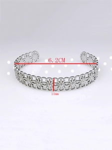 Detail view of hollow flower pattern bangle with 6.2cm diameter and 11mm width