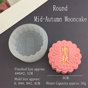 Detail of round mooncake silicone mold with pink mooncake showing Mid-Autumn carving
