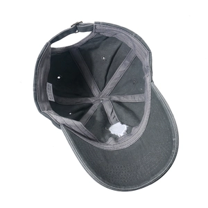 Detail view of cotton baseball cap interior showing wash label and stitched structure