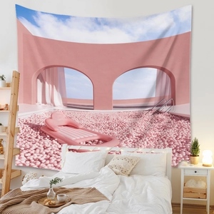 Detail view of Bohemian pink surrealist tapestry hung above a bed in a cozy bedroom