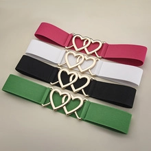 Detailed view of elastic belts with heart buckles in rose, white, black and green