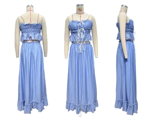 Detailed view of light blue two-piece set with pleated bandeau top and ruffled skirt