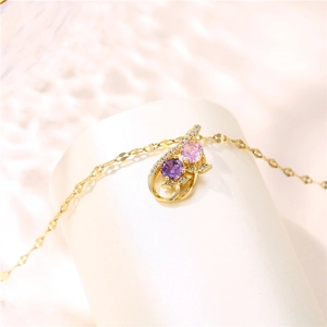 Elegant gold titanium steel necklace featuring purple and pink zircon floral pendant