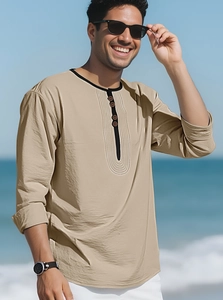 Detail of khaki linen Henley shirt with black trimmed neckline and wooden buttons
