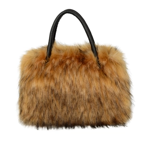 Brown faux fur tote bag with black leather handles and fluffy plush texture on white background