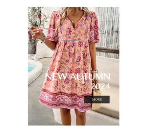Close-up of V-neck bohemian floral print dress with ruffled hem in sunny outdoor setting