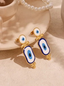Detailed close-up of gold stainless steel evil eye earrings with blue enamel finish