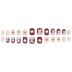 Red and pink press-on nails set featuring cute rabbit illustrations and glitter hearts