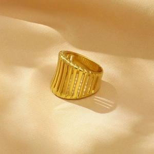 Detailed view of 18K gold plated hollow wide band ring with vertical linear pattern