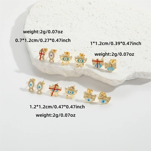 Evil Eye and Fish shape earring set in gold with blue enamel and sparkling cubic zirconia