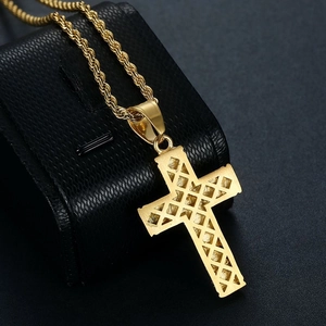 Detailed view of gold plated cross pendant featuring a hollow mesh grid pattern on back