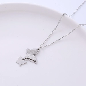 Elegant silver butterfly necklace with frosted and polished double pendants for women