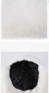 Detail showing plush white faux fur and quilted black lining of a winter trapper hat
