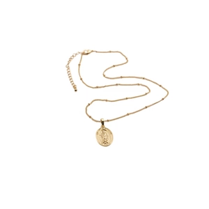 Detail of gold-plated copper zircon necklace with lobster clasp and extender chain