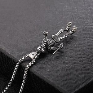 Vintage stainless steel necklace with skeleton hugging sword pendant and box chain