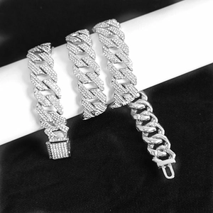 Detail view of 15mm silver cuban link chain with three rows of clear CZ stones