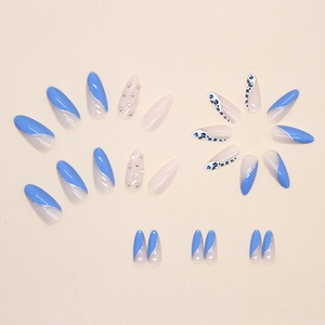 Almond-shaped blue leopard print press-on nails with rhinestones and silver glitter