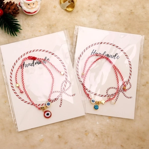 Handmade Christmas evil eye cross charm bracelet with imitation pearls and red-white cord