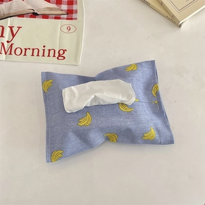 Top view of a blue linen car tissue bag with yellow banana patterns and a top opening