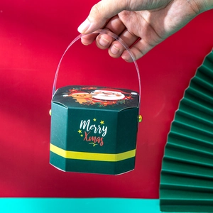 Christmas hexagon gift box in green with yellow ribbon pattern and clear handle