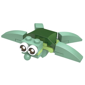 Close-up of a DIY building block turtle model for kids with cute big eyes and green parts