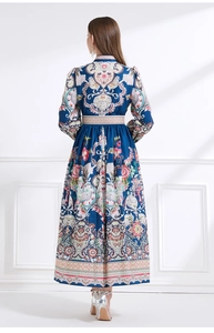 Detailed back view of a vintage court-style maxi dress with ethnic floral patterns