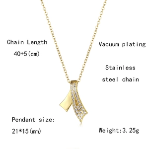 Close-up of golden stainless steel bow necklace with zircon details and size dimensions