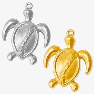 Detailed view of silver and gold 304 stainless steel turtle pendants with glossy finish