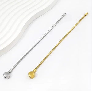 Macro detail of high-quality gold and silver snake bone chains with ball connectors