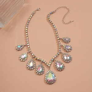 Elegant silver-toned necklace featuring teardrop holographic rhinestones for evening wear