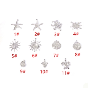 Silver ocean and celestial themed charms collection including starfish, shells and turtles