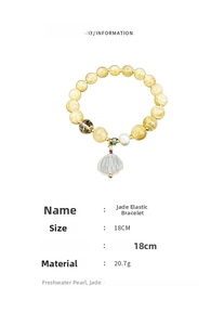 Detail of jade elastic bracelet with freshwater pearl and white shell pendant charm