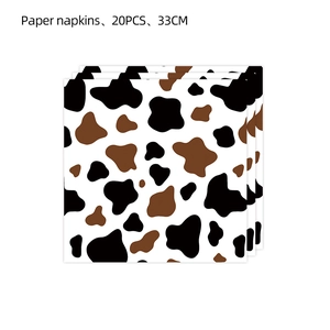 Close-up of 20-piece cow print paper napkins measuring 33cm for themed party decor