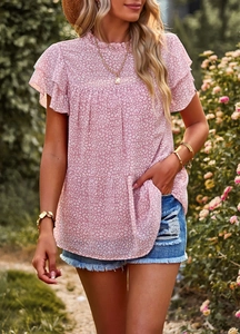 Detailed view of pink leopard print top with ruffle cap sleeves and high crew neckline