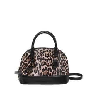 Minimalist leopard print shell handbag with black leather accents and golden hardware