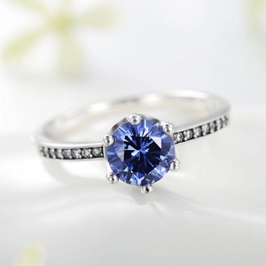 Classic S925 silver crown ring with round blue zircon and brilliant pavé diamond accents