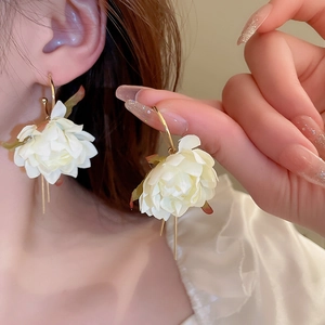 Elegant white fabric flower earrings with gold hooks and leaf accents for women