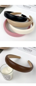 Collection of wide PU leather padded headbands in various neutral colors for hair styling