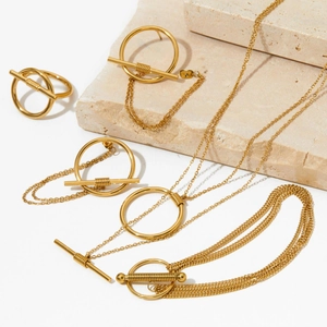 Minimalist gold stainless steel jewelry set featuring OT buckle necklace and earrings