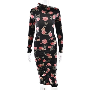 Detail of floral print and ruched texture on a slim-fit long sleeve dress