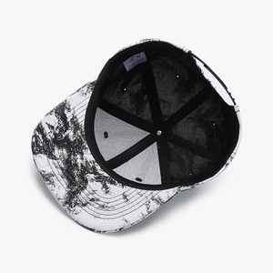 Flat brim baseball cap with black and white abstract tie-dye pattern and adjustable strap