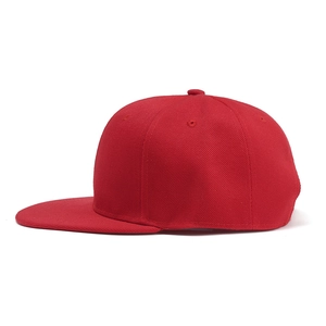 Detail view of red flat-brim hip hop cap featuring durable twill cotton fabric texture