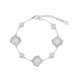 925 silver bracelet featuring natural baroque pearls and white shell charms on white background