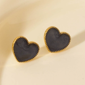 Irregular gold heart stud earrings with dark grey matte inlay and polished finish