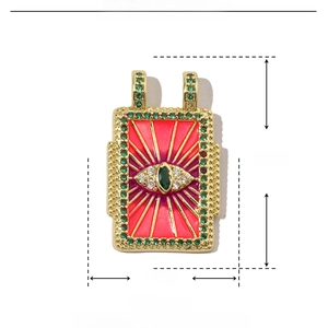 Makroaufnahme von Kupfer-Auge-Anhänger mit roter Emaille, Zirkonia-Steinen und 27x17mm Maßen