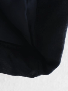 Detailed close-up of premium textured outer fabric and smooth lining of the winter jacket