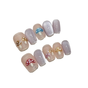 Handmade press-on nails with 3D colorful mushroom designs and lilac glitter finish