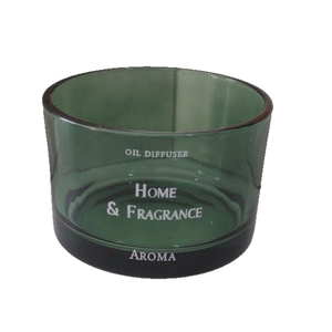Green cylindrical glass oil diffuser and candle holder with white Oil Diffuser text